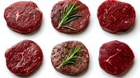 Fresh raw beef steaks collection with rosemary herbs isolated on white background for culinary design and restaurant menu concepts.