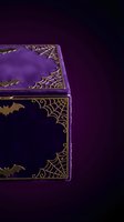 Ornate purple jewelry box with golden spider web decorations and velvet interior on dark gradient background for luxury product photography.