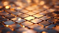 Close-up of glowing golden metallic tiles with warm light reflections, creating an abstract geometric pattern suitable for technology, luxury, and modern design backgrounds.