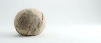 Whole coconut with brown fibrous husk on clean white background, isolated tropical fruit for healthy cooking and natural ingredients in culinary projects.