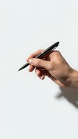 Male hand holding black pen in writing position against clean white background for business and office design projects.