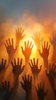 Raised hands silhouettes against warm golden sunset sky representing unity, hope, celebration, teamwork, community support, volunteering and collective action.