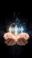 Cupped hands holding glowing human figures with magical sparkles and light effects representing teamwork, leadership and human resources management.