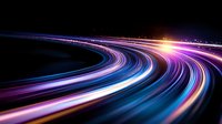 Curved light trails in motion on dark background with vibrant neon colors of blue, purple and pink creating dynamic streaks of speed and technology concept.