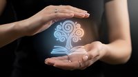Hands protecting glowing open book with swirling light patterns symbolizing knowledge protection, education security, and learning preservation concept.