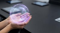 Hand holding glowing holographic sphere with digital data visualization, representing technology innovation, artificial intelligence, and future business solutions for corporate presentations.