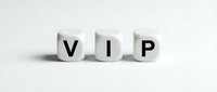 White wooden blocks spelling VIP on clean background representing exclusive membership, premium service and luxury status concept for business marketing.