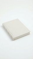Blank hardcover book with beige linen cover isolated on white background for mockup design projects and publishing concepts.