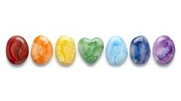 Colorful gemstones arranged in rainbow order from red to purple, isolated on white background. Suitable for jewelry design, wellness graphics, chakra illustrations, and decorative projects.