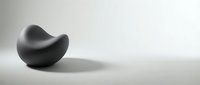 Black curved abstract form on neutral surface with soft shadow, suitable for modern design, branding, and minimalist backgrounds.
