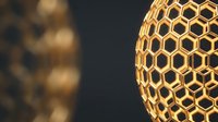 Golden honeycomb sphere with hexagonal pattern glowing against dark background, suitable for abstract design, technology, and architectural visualization projects.