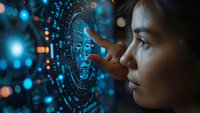 Young Asian woman interacting with futuristic holographic interface displaying circular data visualization, side profile against blue bokeh background with digital elements.