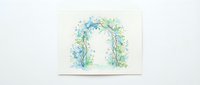 Watercolor floral arch with blue and green flowers, isolated on white background, ready for wedding invitations, greeting cards, and design projects.