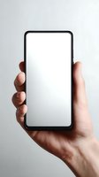 Hand holding modern smartphone with blank white screen against neutral background, mockup for app or website design.