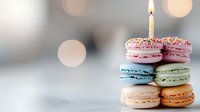 Colorful stack of macarons with lit birthday candle on top, celebrating special occasion against soft bokeh background.