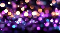 Glowing purple and orange bokeh lights creating magical atmosphere on dark background, soft focus circular light spots for festive designs.