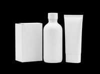 Blank white cosmetic packaging set with box, bottle, and tube isolated on transparent background, ready for branding mockups, print on demand, and design use.