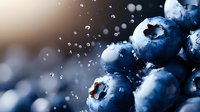 Fresh blueberries with water droplets splashing in sunlight creating dynamic motion for healthy eating and nutrition concepts.
