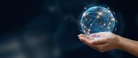 Hand holding glowing digital network sphere with connected nodes representing global connectivity, technology innovation and data communication concepts.