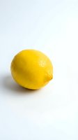 Fresh yellow lemon isolated on white background for culinary design and healthy lifestyle concepts.