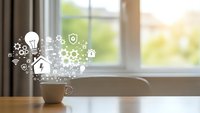 Coffee cup with smart home technology icons floating above on wooden table by bright window. Modern IoT connectivity concept for digital lifestyle automation.