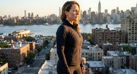 Young professional woman in business attire standing on urban rooftop at sunset with city skyline and river view, corporate lifestyle and career success concept.