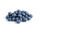 Fresh organic blueberries pile isolated on white background for healthy eating, smoothies, baking and culinary designs.