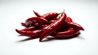 Red chili peppers isolated on white background, fresh spicy ingredients for cooking and food preparation, suitable for culinary designs.