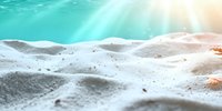Underwater sandy seabed with sunlight rays penetrating through turquoise water creating dreamy atmosphere. Suitable for marine life, ecology and environmental projects.