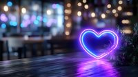 Glowing neon blue heart shape illuminates dark urban scene with bokeh lights and reflective wet surface creating romantic nighttime atmosphere.