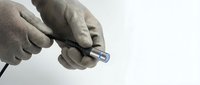Medical professional hands holding insulin pen for diabetes treatment and blood sugar management in healthcare setting.