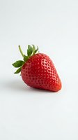 Fresh red strawberry with green leafy crown isolated on white background, ready for food and beverage design, packaging, and culinary marketing materials.