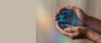 Man holding glowing digital sphere with holographic interface and light rays, representing technology, innovation, and digital transformation for business and futuristic concepts.