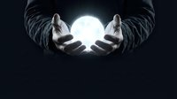 Businessman hands holding glowing sphere of light in dark space representing innovation, future technology, energy and creative solutions for business.
