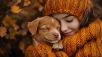 Young Asian woman in orange knit sweater and beanie hugging adorable sleeping puppy outdoors during autumn season with golden leaves background.