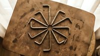 Vintage wooden butter mold with carved flower pattern, traditional kitchen utensil for culinary crafts and rustic home decor on white background.