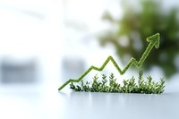 Growing green arrow graph made of small plants and leaves showing upward trend on white background, representing sustainable business growth and eco-friendly development.