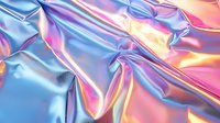 Holographic iridescent fabric with blue and pink metallic sheen, wrinkled textile surface creating abstract light reflections and dynamic folds.