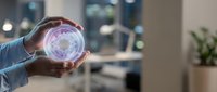 Professional businessman holding glowing digital sphere with futuristic holographic interface in modern office environment for technology presentations.