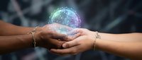 Two hands gently holding glowing digital sphere with network connections representing technology collaboration, teamwork and innovation in business.