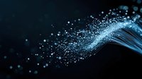 Glowing blue particles and light trails flowing dynamically against dark background create magical atmosphere. Abstract design element for technology concepts.