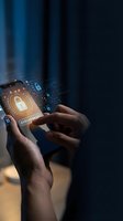 Hands holding smartphone with digital security lock interface and glowing cybersecurity icons for data protection and mobile privacy technology.