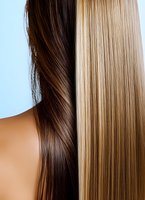Contrasting straight blonde and brunette hair strands showing different hair colors and textures against light background, highlighting professional hair care and styling results.