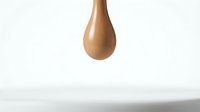 Isolated bronze or copper liquid droplet suspended against white background, suitable for design projects, web graphics, and commercial applications.