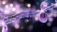 Glowing purple water drops connected by crystalline splash with bokeh light effects in macro photography on dark background. Artistic liquid motion capture.