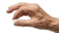 Senior adult hand with age spots and wrinkles gesturing holding or measuring isolated on white background for healthcare, aging, medical education, and wellness design projects.
