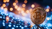 Golden cryptocurrency coin against blurred blue and orange bokeh lights background creating magical atmosphere for financial technology concept.