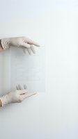 Hands in white medical gloves holding transparent puzzle pieces on clean white background for healthcare problem solving and teamwork concepts.