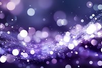 Abstract purple background with glowing bokeh lights and sparkling magical dust trail effect creating dreamy atmospheric composition. Suitable for festive designs.