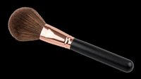 Makeup brush with natural bristles, rose gold ferrule, and black handle isolated on transparent background. Ready for clipart, sublimation, print-on-demand, t-shirt design, and beauty product graphics.